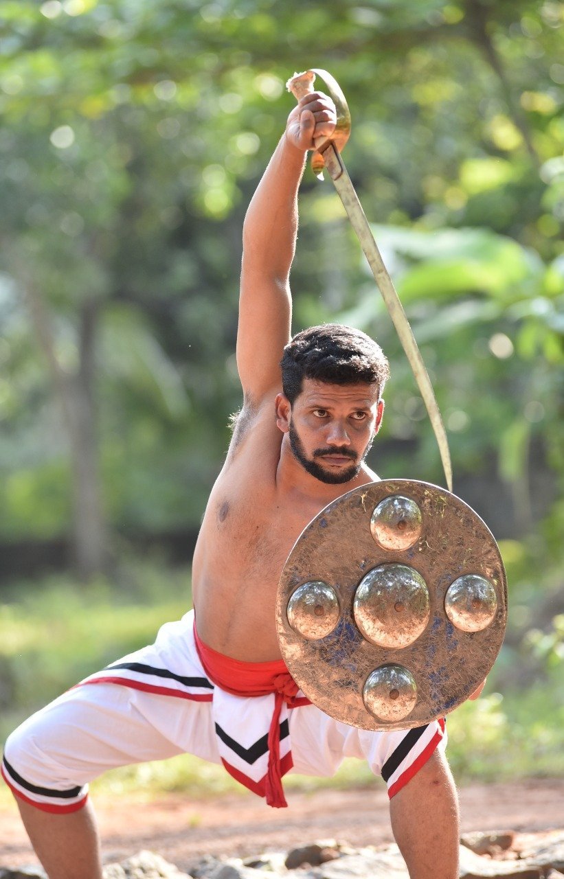 T. Shaheer Gurukkal in val-paricha pose - Gurukkal of K.G.S. Kalari Sangham
